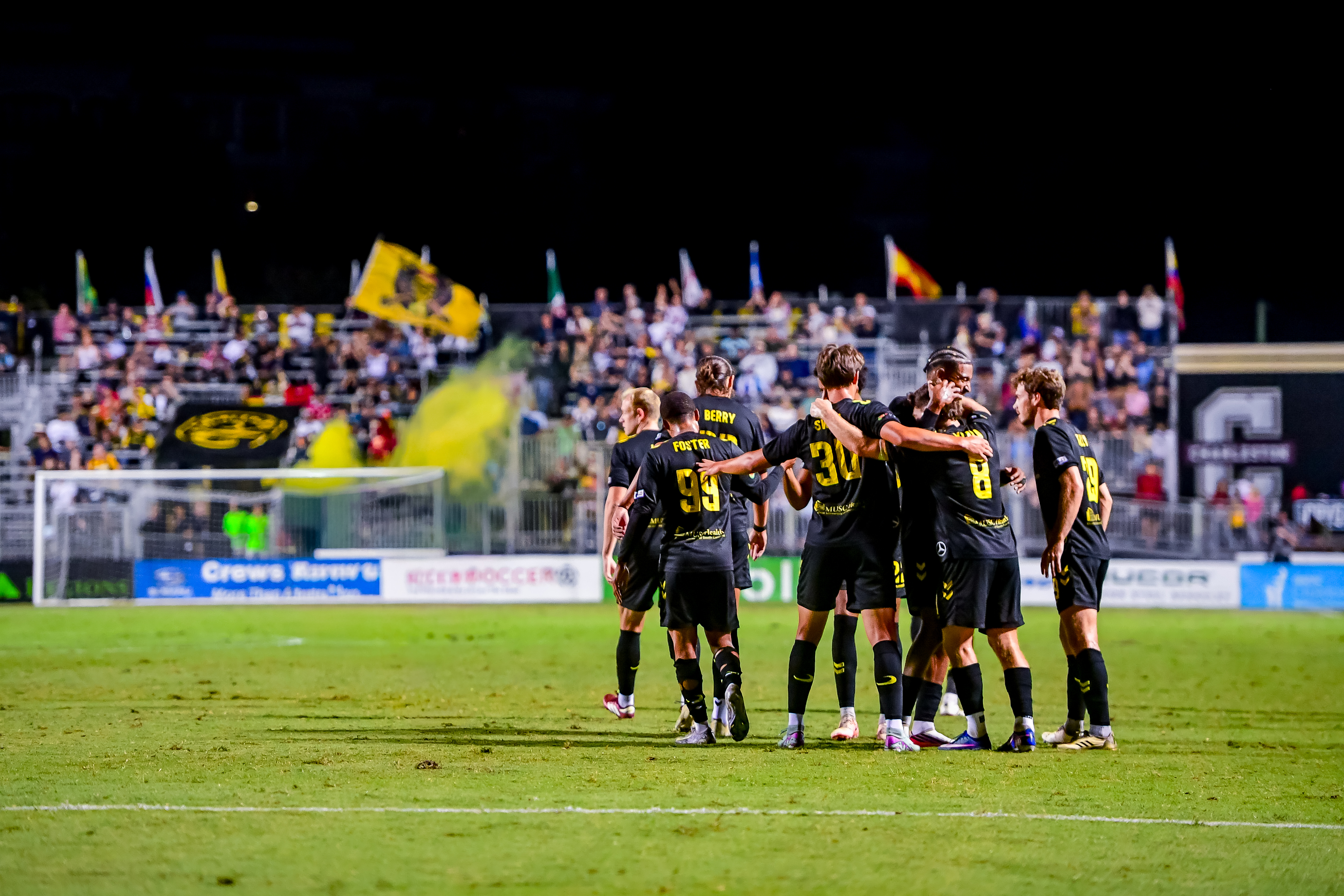 Charleston Battery players celebrating together at Patriots Point